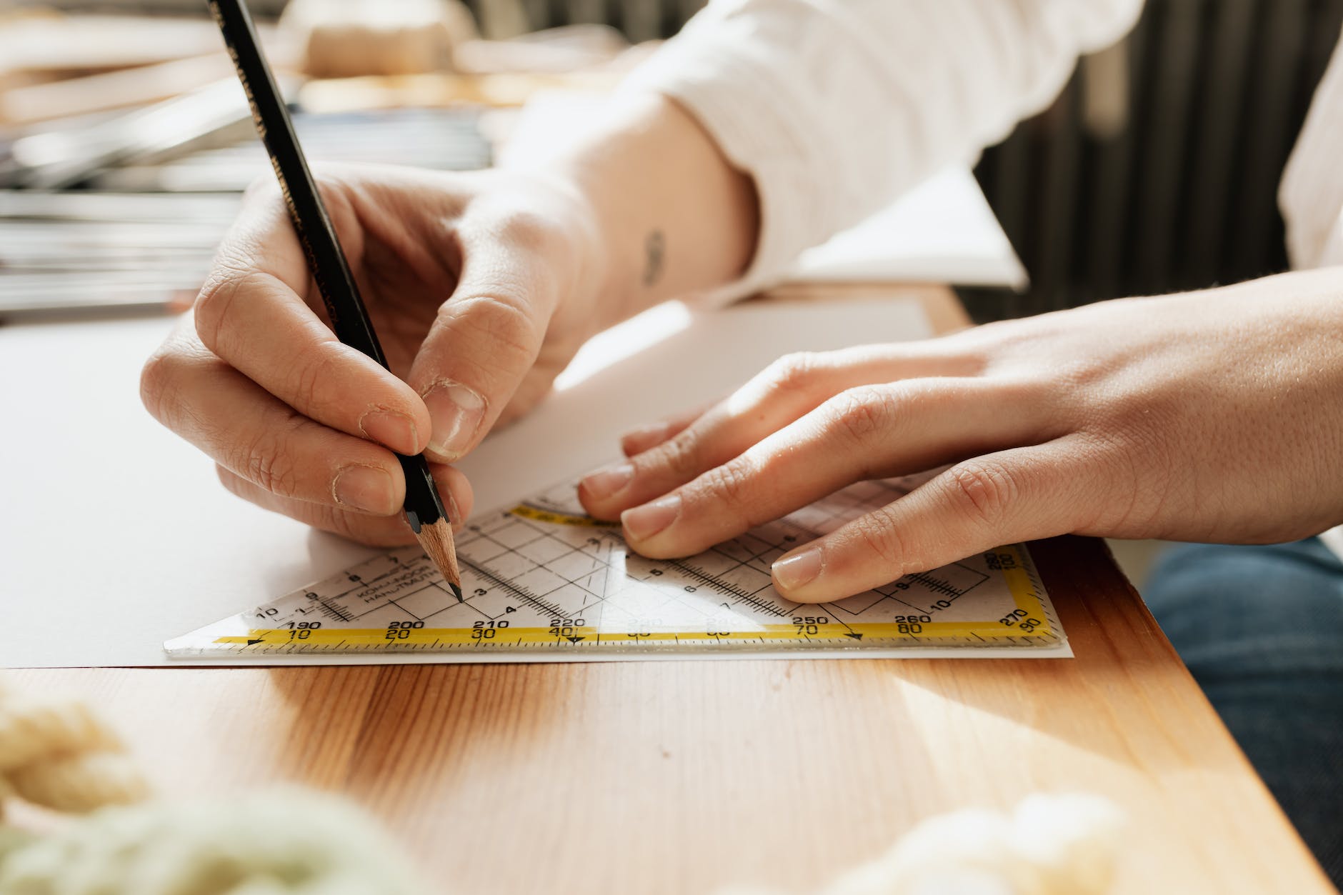 person writing on white paper